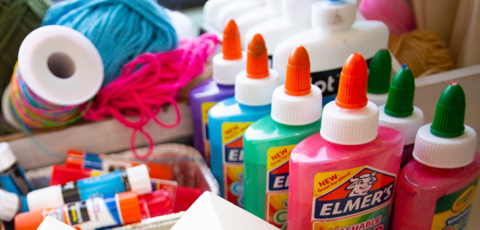 closeup photo of elmers glue and art supplies